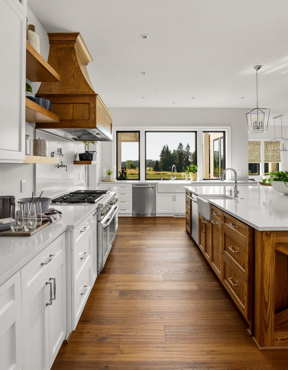 New kitchen with white shaker cabinets and wood island