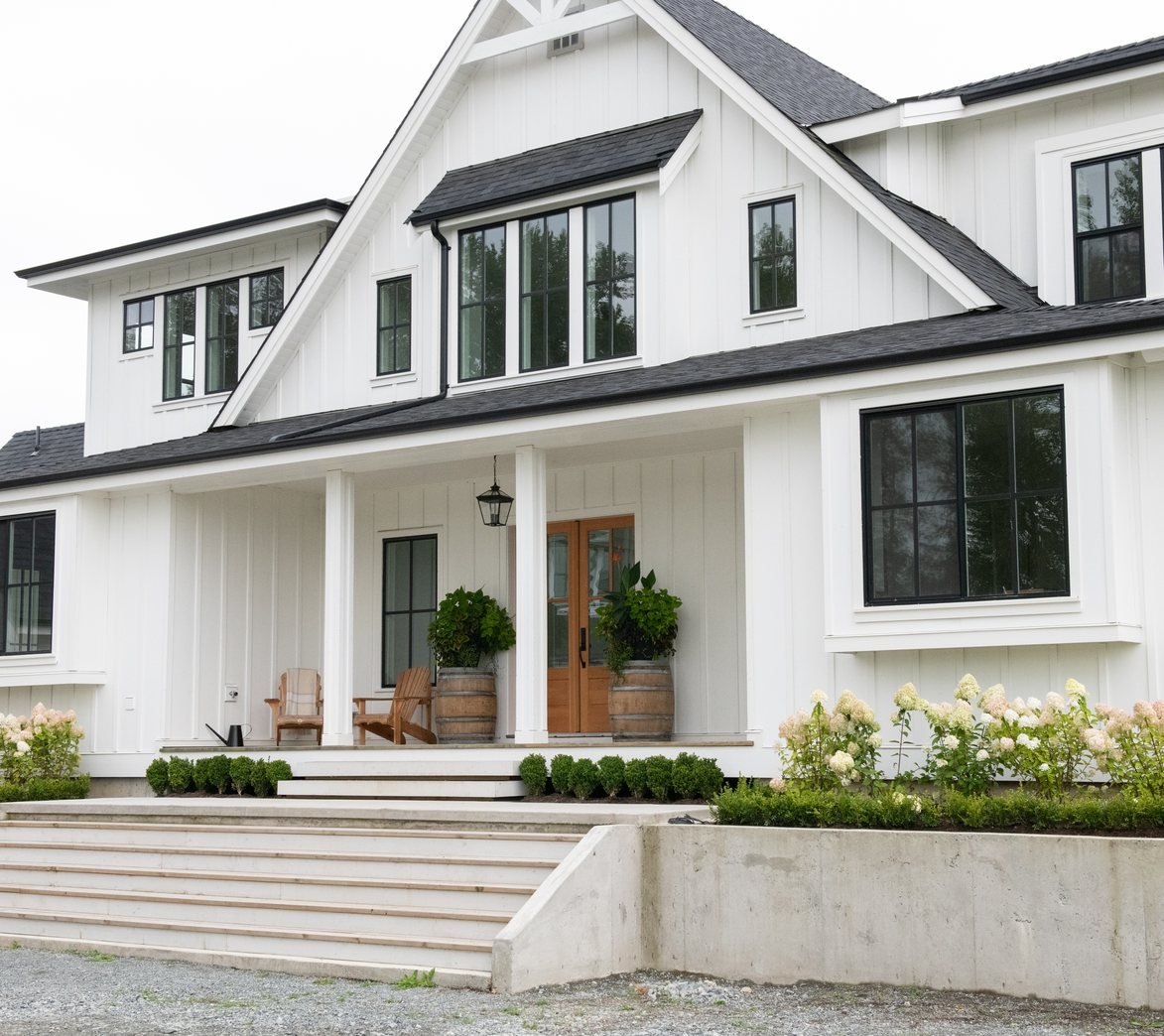 White modern farmhouse exterior with covered porch